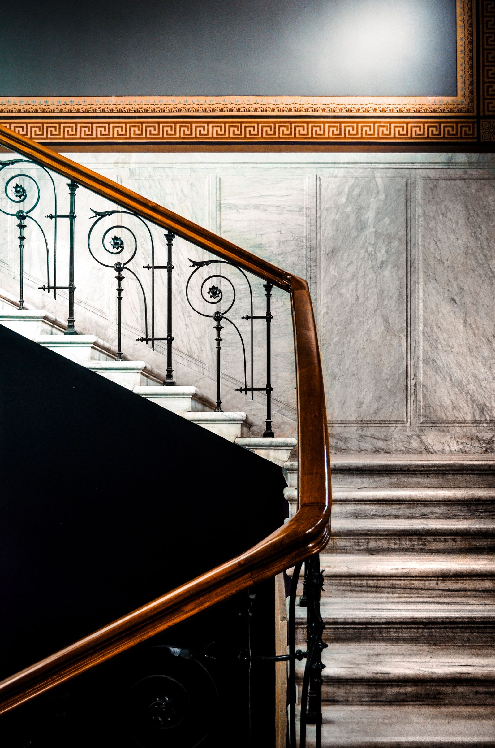 Marble staircase with gold railing